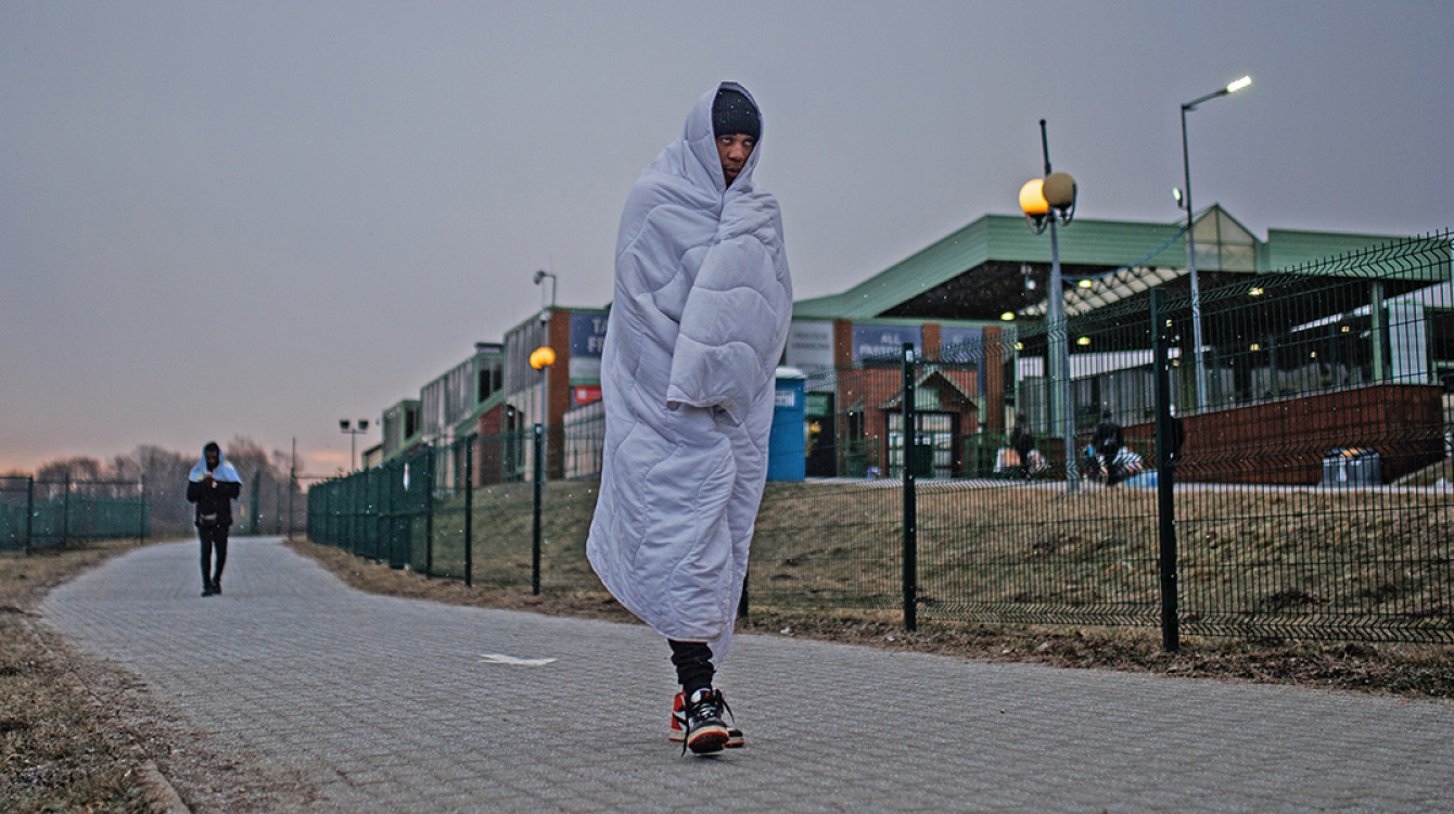 Young man from Comoros crossing border into Poland from Ukraine