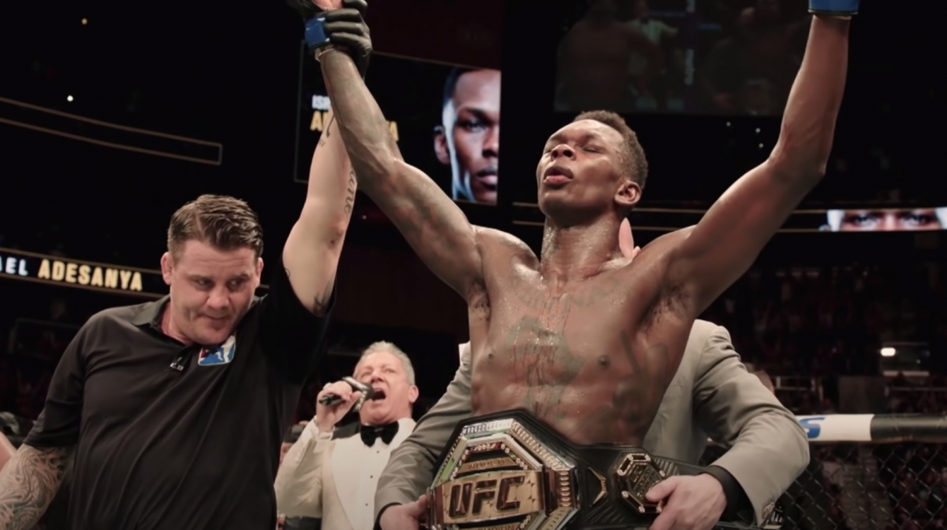 Israel Adesanya, with his UFC middleweight world champion belt