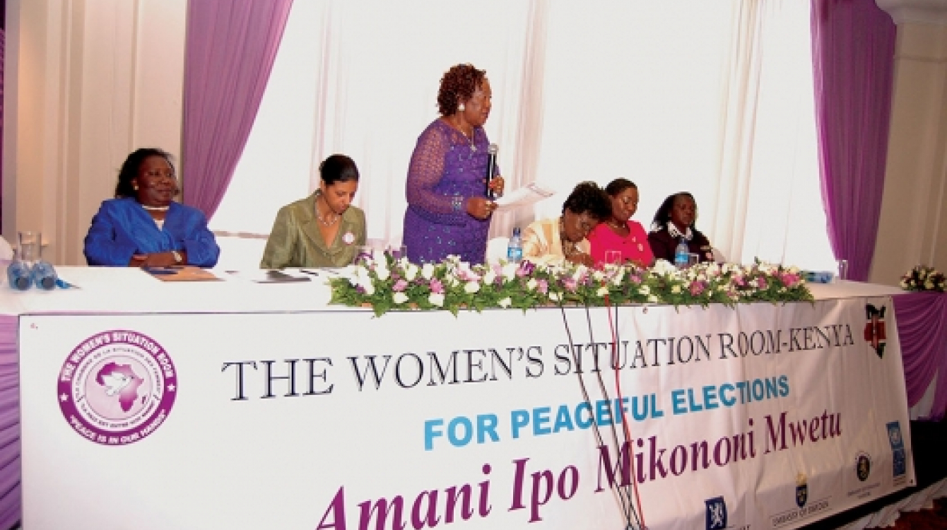 Women leaders and representatives of Kenya’s electoral body, the police and the UN sit at the Women’s Situation Room in Nairobi, Kenya that used diplomacy to help reduce  electoral violence during Kenya’s last general elections. Photo: Joseph Mathenge