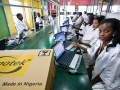 Technicians assemble computers at the Omatek factory in Lagos, Nigeria. Photo: Panos/Sven Torfinn