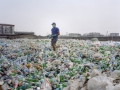 A man sorting a sea of plastic bottles at one of the Wecycler hubs in Lagos, Nigeria. Most plastic litter from cities ends up in oceans. 