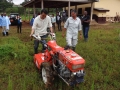 Japan’s senior vice-minister of agriculture, forestry and fish eries Taku Eto tries out a Japanese-made tilling machine in Cameroon.  Photo: The Government of Japan