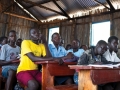 Refugee students in a classroom in Uganda. Photo: UN Photo/Mark Garten