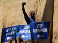 A protester outside the Constitutional Court in Johannesburg, South Africa. Photo: AP Photo/Denis Farrell