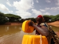 A woman drawing water from a man-made pond in drought-stricken Somali.  Photo: UNDP Somalia