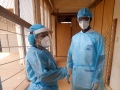 Dr. Babio (left) and Dr. Amoussouvi preparing for the visit of all hospitalized patients. 