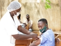 Man receiving COVID-19 vaccine.