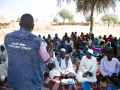 CRS staff addressing the community in Hashaba village, West Darfur, Sudan.