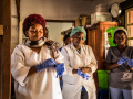 Health workers in the DRC put on gloves on before checking patients at the hospital.