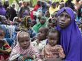 Internally displaced mothers with their children attend a WFP famine assessment exercise in Borno