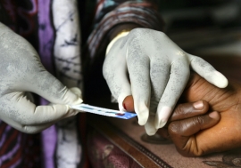 A woman has her blood taken for a test at a clinic in Freetown, Sierra Leone. Photo: Panos/ Giacomo Pirozzi