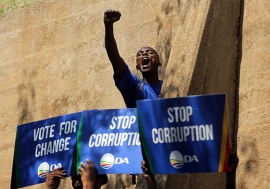 A protester outside the Constitutional Court in Johannesburg, South Africa. Photo: AP Photo/Denis Farrell