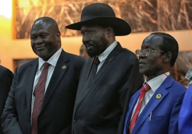 Salva Kiir, President of South Sudan, (centre right) shakes hands with Riek Machar, who was sworn in as First Vice President of the new Transitional Government of National Unity on 22 February 2020.