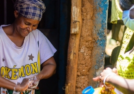In the Kibera slum in Nairobi, Kenya, residents are provided with soap and water to wash their hands in order to help halt the spread of the coronavirus.
