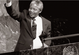 Nelson Mandela, then Deputy President of the African National Congress of South Africa, raises his fist in the air while addressing the Special Committee Against Apartheid in the General Assembly Hall.