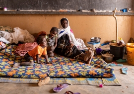 A displaced family from a village in Mali was relocated to a former school.