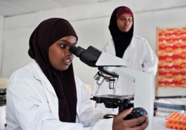 Young women study in a science laboratory at Mogadishu University, Somalia. Photo: Panos/Sven Torfinn