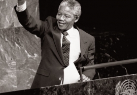 Nelson Mandela, then Deputy President of the African National Congress of South Africa, raises his fist in the air while addressing the Special Committee Against Apartheid in the General Assembly Hall.