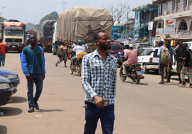 People and trucks cross at the Ghana-Côte d'Ivoire border at Elubo.