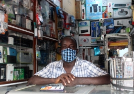 A trader in his electronics shop in the market in Treichville, Abidjan, during the COVID-19 crisis. 