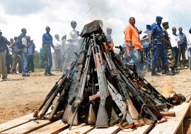 Weapons being burnt during the official launch of the Disarmament, Demobilization, Rehabilitation and Reintegration (DDRR) process in Muramvya, Burundi.             UN Photo/Martine Perret