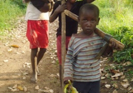 Some of Teddy Nakawoeisi’s grandchildren returning from work on a nearby farm