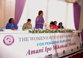 Women leaders and representatives of Kenya’s electoral body, the police and the UN sit at the Women’s Situation Room in Nairobi, Kenya that used diplomacy to help reduce  electoral violence during Kenya’s last general elections. Photo: Joseph Mathenge