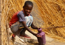 In Blue Nile State in Sudan a boy washes his hands in a village where UNICEF has been promoting good hygiene practices.