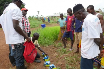 Mobile phones with solar-powered chargers are distributed to all Ebola-quarantined homes in Sella Kafta, Sierra Leone, allowing them to stay in touch with friends and family, which lessens anxiety and resentment. 