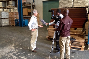 In the UN Humanitarian Response Depot (UNHRD) warehouse in Accra, Ghana, UNMEER's head, Anthony Banbury (left), spoke to some international media outlets on the latest developments in the Ebola Response. Photo: UNMEER