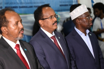 Former Presidents of Somalia, Hassan Sheikh Mohamud (left) and Sharif Sheikh Ahmed (right) stand side by side with the new president of Somalia Mohamed Abdullahi Farmaajo at the inauguration ceremony in Mogadishu on February 22, 2017.