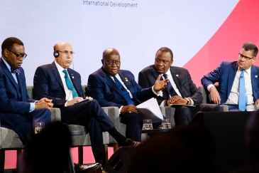 A group of five people at the leaders panel on stage at the UK-Africa Investment Summit.