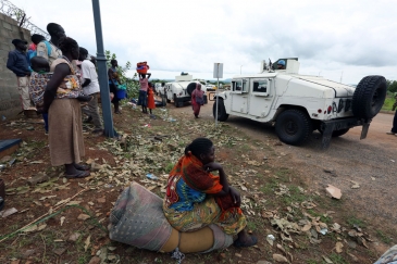 Displaced civilians leave the UNMISS (UN Mission in South Sudan) base in UN House, after seeking refuge at the base in the wake of recent fresh clashes in Juba between soldiers of the Sudan People's Liberation Army (SPLA) and the SPLA in Opposition (SPLA-