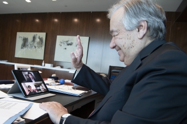 Secretary-General António Guterres in a three-way video call with frontline mental health workers, Mr. Umair Bachlani in Pakistan and Ms. Charlene Sunkel in South Africa. UN Photo/Eskinder Debebe