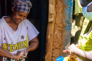 In the Kibera slum in Nairobi, Kenya, residents are provided with soap and water to wash their hands in order to help halt the spread of the coronavirus.