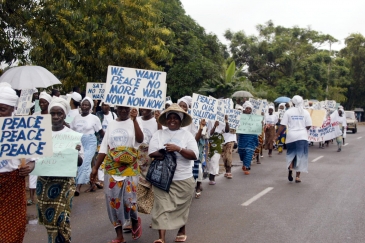 Liberian women marching through the streets of Monrovia agitating for peace. 