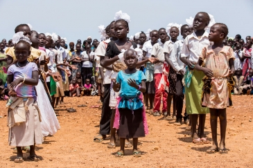 Children at a protection of civilians site in Juba, South Sudan, run by the UN Mission, perform at a special cultural event in March 2015. UN Photo/JC McIlwaine