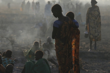 Families wait in the early hours of the morning to be registered prior to a food distribution carried out by the United Nations World Food Programme (WFP) and partner agencies, in Thonyor, Leer county, South Sudan. Photo: © UNICEF/UN0234655/Modola. 