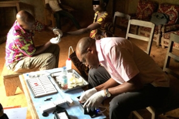Testing of the mobile phone-based video microscope in Cameroon. Photo: NIAID.