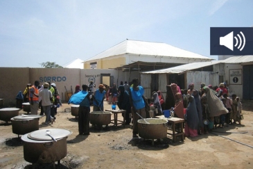 Aid workers prepare food for Somalis at a World Food Programme-supported feeding centre in the capital, Mogadishu. Photo: OCHA/A. Gaitanis