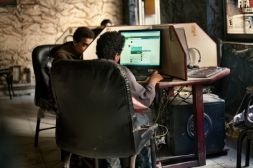 Young men using computers in a cybercafe in Cairo, Egypt, where Khaled (Jaled) Said, a 28-year-old blogger, was arrested and beaten to death by police in 2010. Later, 400,000 people joined the ‘We’re all Khaled Said’ campaign on Facebook is considered one