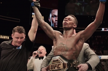 Israel Adesanya, with his UFC middleweight world champion belt