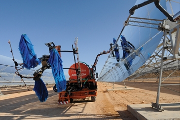 Solar panels being cleaned at the Ain Beni Mathar Integrated Combined Cycle Thermo-Solar Power Plant in Morocco.  World Bank/Dana Smillie
