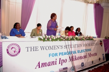 Women leaders and representatives of Kenya’s electoral body, the police and the UN sit at the Women’s Situation Room in Nairobi, Kenya that used diplomacy to help reduce  electoral violence during Kenya’s last general elections. Photo: Joseph Mathenge