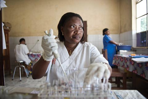 A lab worker tests blood for HIV in the Democratic Republic of the Congo.