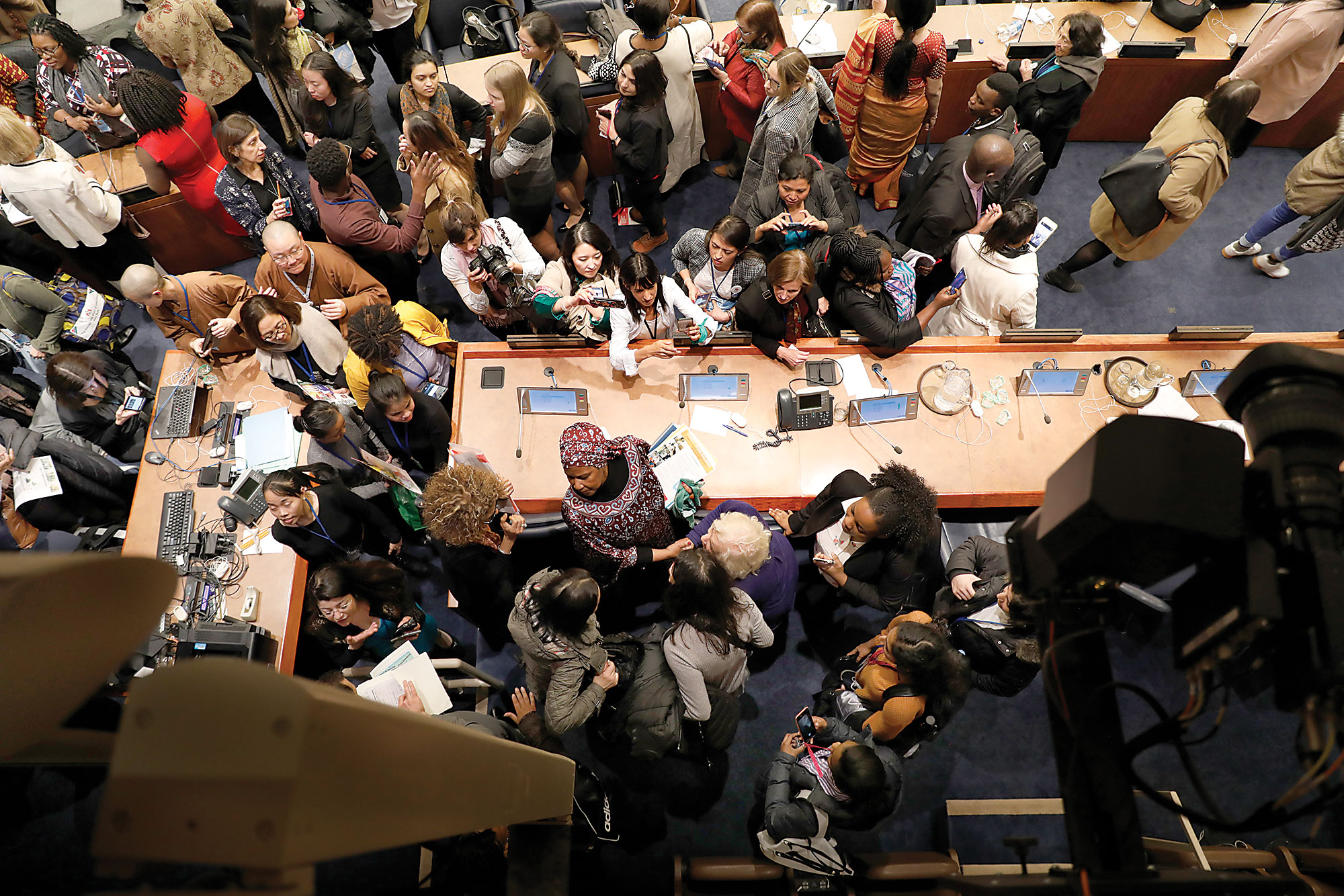 Photo from above showing people around a conference table