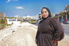 Maisaa posing besides the extension road she initiated in Dar Salah to resolve traffic after she won in the local elections