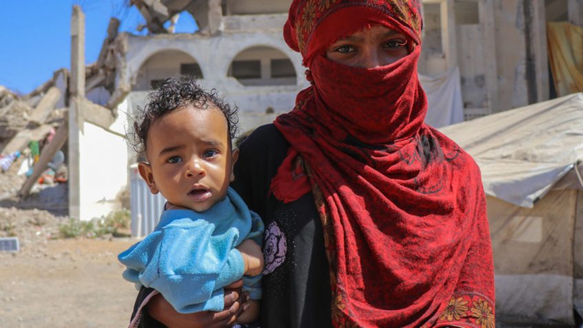 YPN for UNOCHA A mother holds her child in the Al Dhale'e Internally Displaced Persons (IDPs) Camp in Yemen.