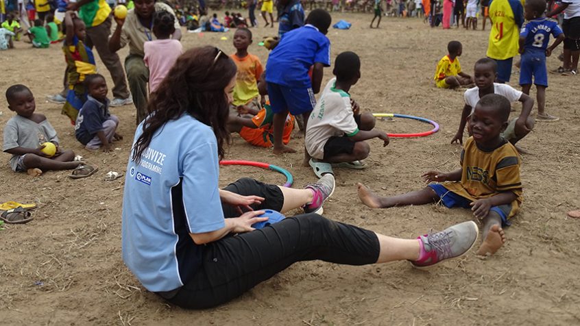 volunteer helping kid