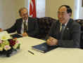 Permanent Representative of Turkey to the United Nations Ambassador Yasar Halit Çevik and DESA's Under-Secretary-General Wu Hongbo at the signing of the host country agreement between the United Nations and Turkey